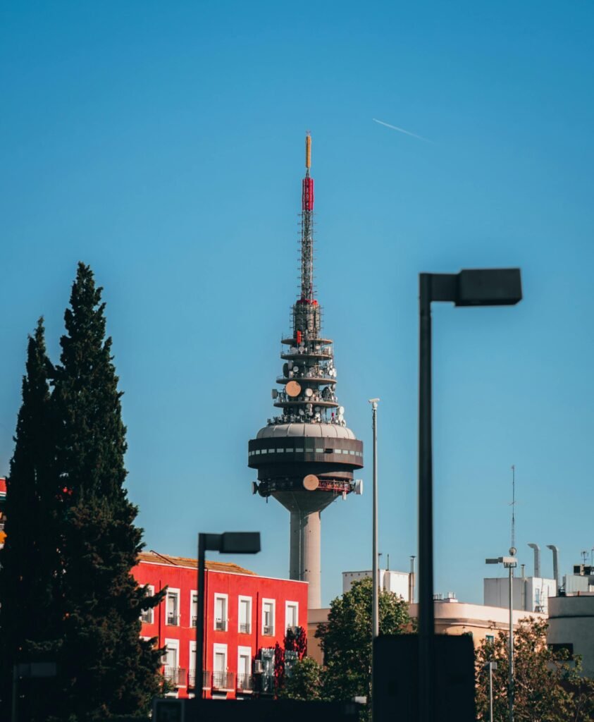 pexels-photo-21855179-21855179 Vertical shot of Madrid's communication tower against clear sky, iconic urban landmark.