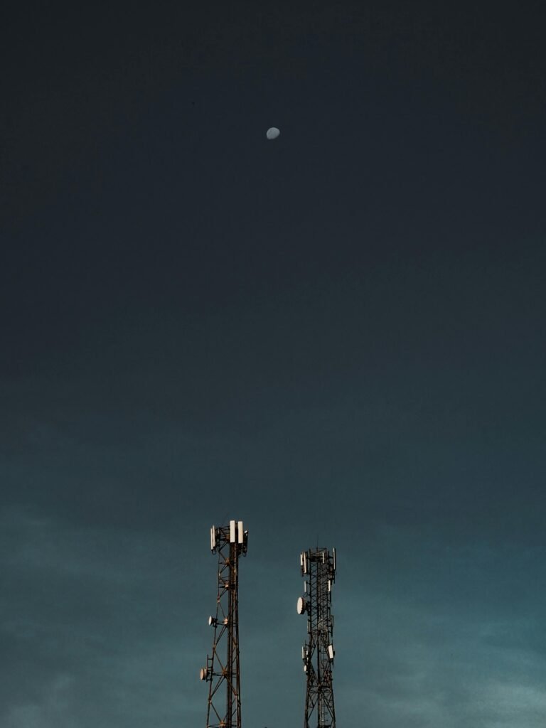 pexels-photo-4444164-4444164 A minimalistic shot of cell towers beneath a darkening sky with the moon visible, set in the Philippines.