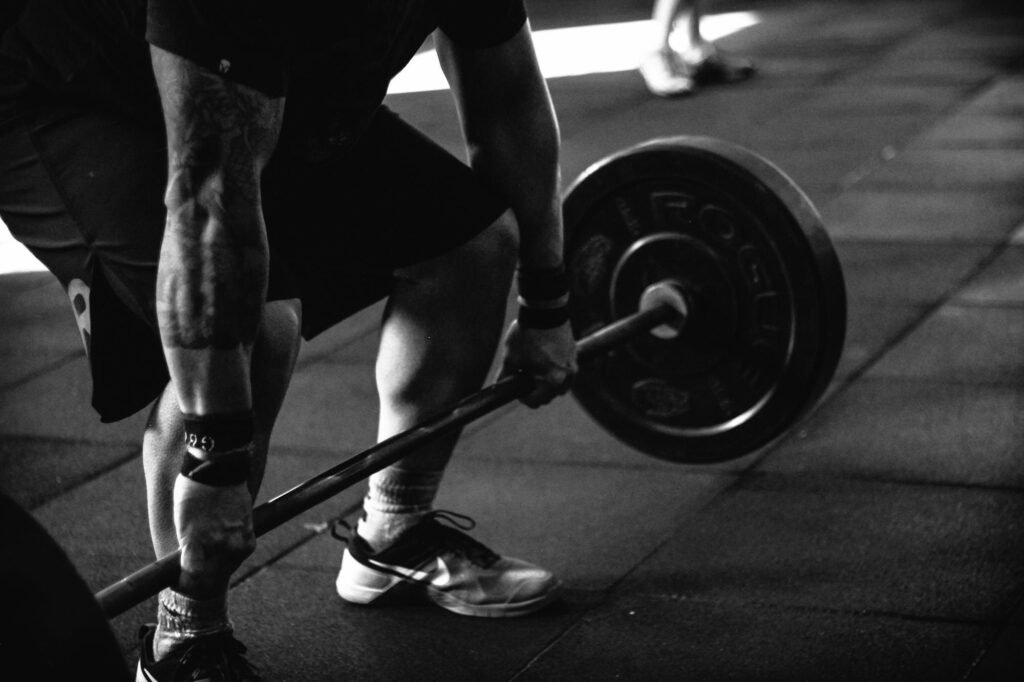 pexels-photo-791763-791763 A powerful black and white image of a man deadlifting in a gym, showcasing strength and fitness.